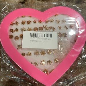 26 pair of gold stud earrings in different shapes.  Great for younger girls